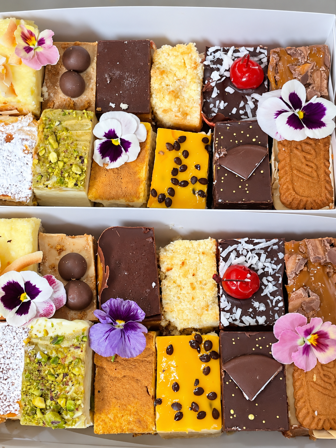 Sweet Sourdough Bakes mixed slice box with assorted homemade slices and edible flower decoration